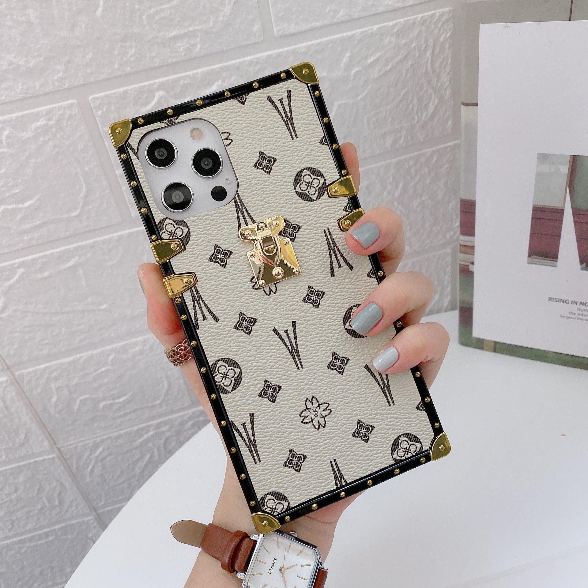 White LV Trunk Series Phone Case with iconic design and timeless appeal for iPhone and Samsung aesthetic statement piece
