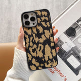 Fashionable leopard print embroidered phone case for iPhone 14 Plus, slim yet protective with luxury fabric.