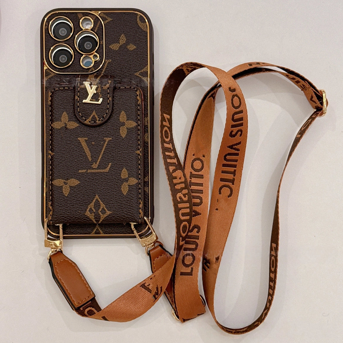 Brown LV-inspired wallet phone case with crossbody strap and card holder for hands-free convenience and Y2K luxury aesthetic