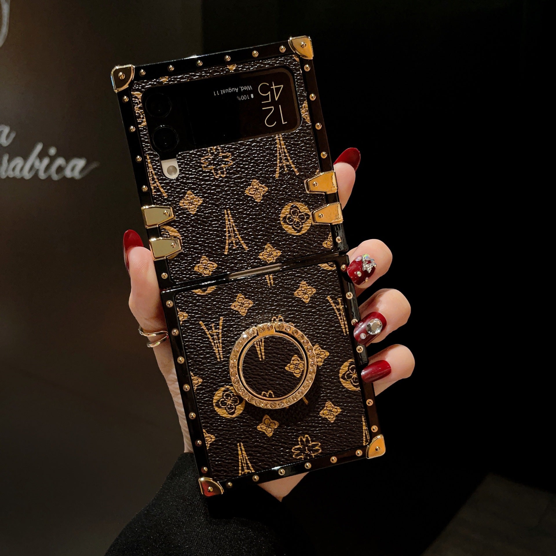 Brown LV Trunk Series Phone Case for Samsung ZFLIP with anti-slip matte finish and shock-absorbent edges for a secure grip and durable protection