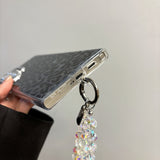 Cheetah Print Glitter Phone Case with Wrist Strap for Samsung Galaxy S24 Ultra - Sparkling animal print design with military-grade protection