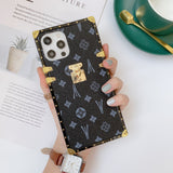 Black LV Trunk Series Phone Case with scratch-resistant matte finish for iPhone and Samsung blending nostalgia with modern chic aesthetic