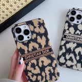 Stylish embroidered cheetah print phone case for iPhone 14 Plus, offering premium protection without bulk.