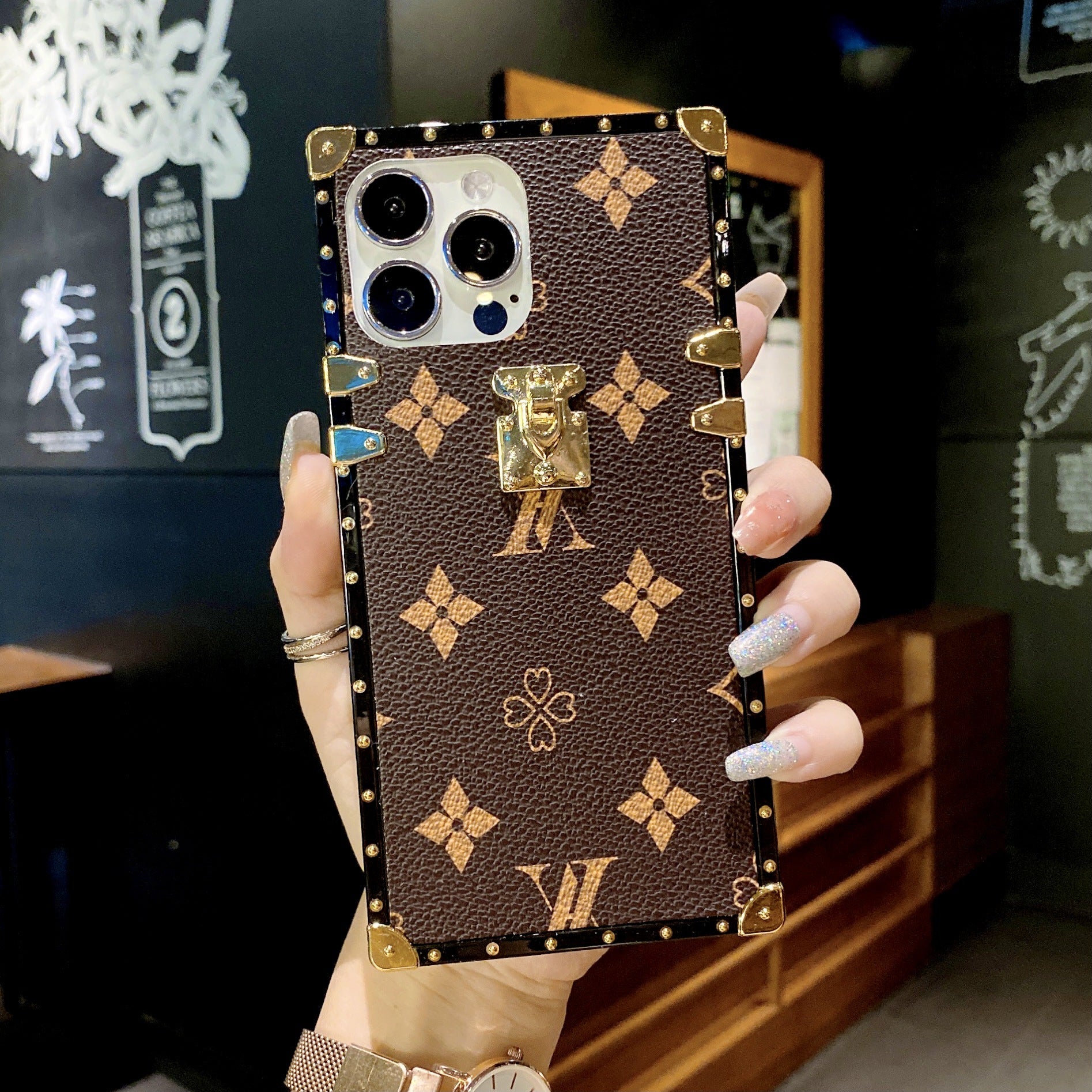 Brown LV Trunk Series Phone Case with fade-resistant coating and LV monogram pattern for iPhone Samsung aesthetic statement piece